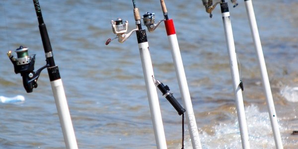 fishing poles at the beach