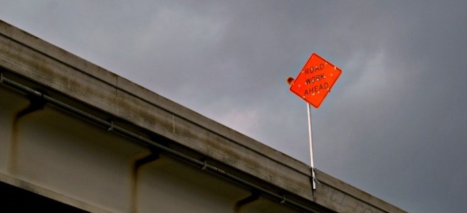 road work sign on bridge