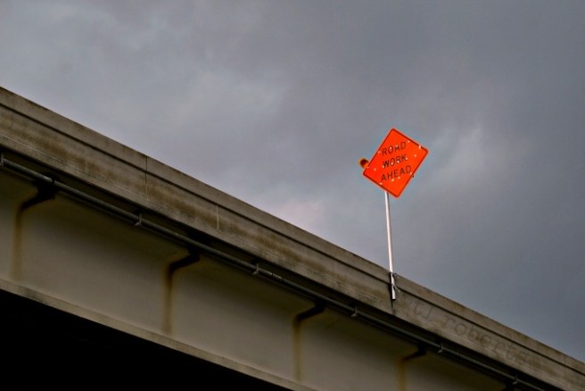 road work sign on bridge