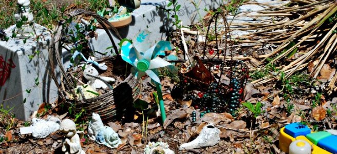 child grave site with toys