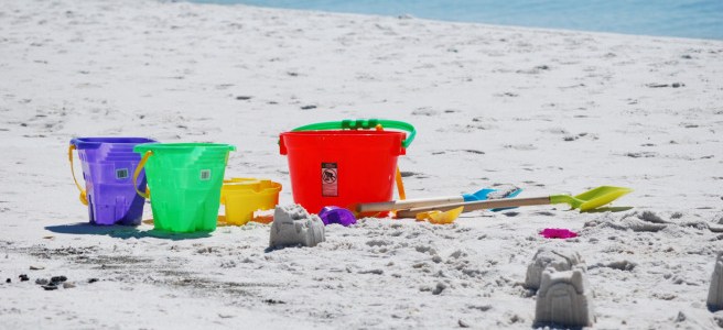toy shovel and pail on beach