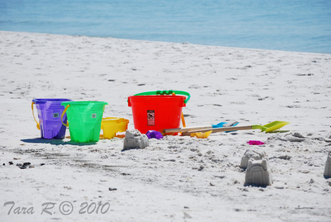 toy shovel and pail on beach