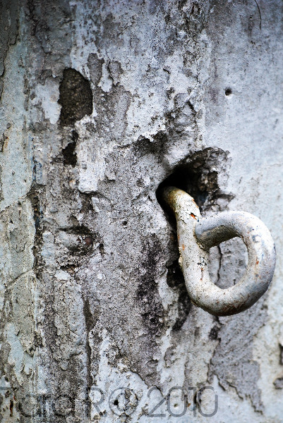 metal hook in stone post