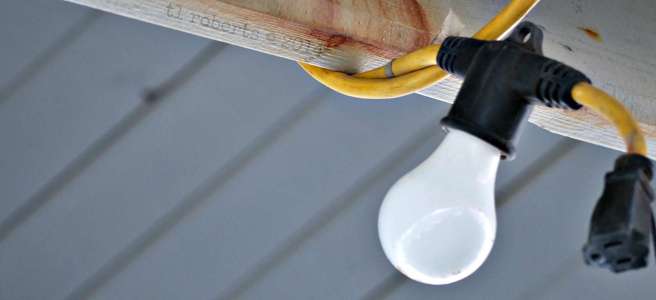 bare light bulb attached to industrial cord