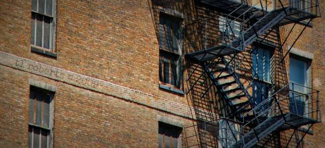fire escape on brown brick building