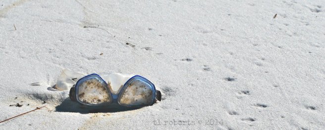 swimming goggles on beach