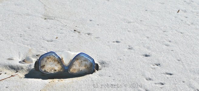swimming goggles on beach