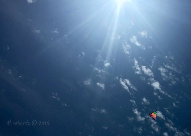colorful kite in deep blue sky