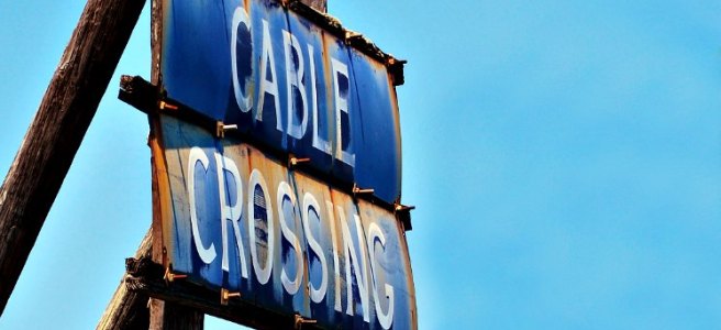 rusty cable crossing sign