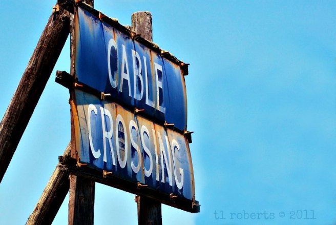 rusty cable crossing sign