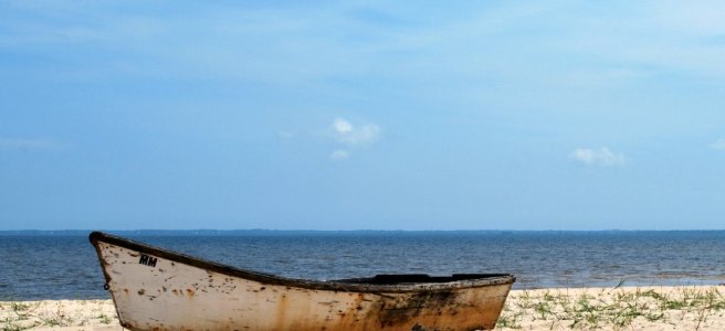 marooned boat on a sandy beach