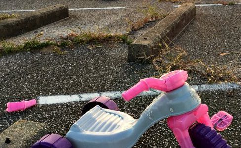 broken pink big wheel tricycle