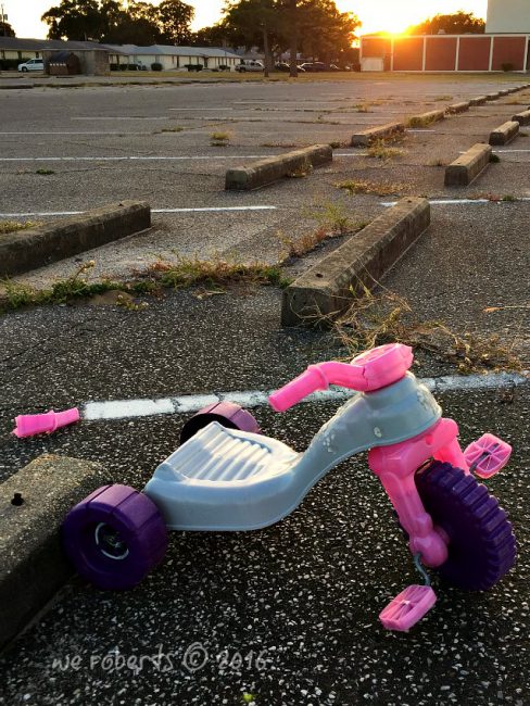 broken pink big wheel tricycle